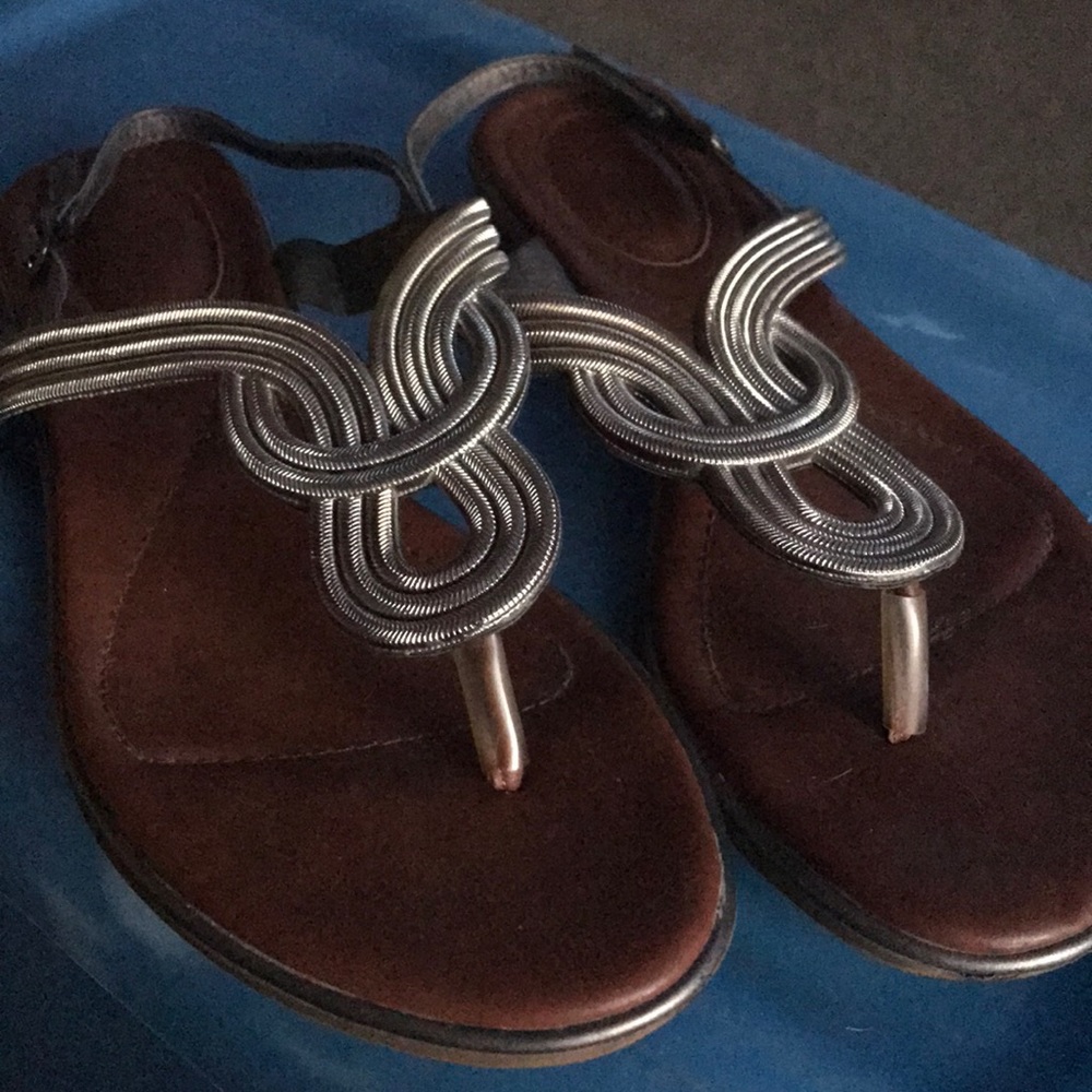 Gently used silver sandals with tan bottoms